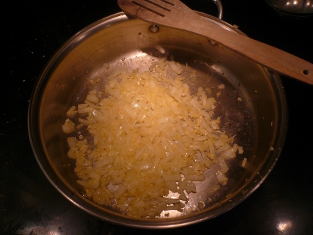 Cooking the onion and garlic in olive oil.